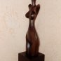 Woman' torso. Wood sculpture, signed.