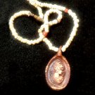 Hand Carved Cameo Necklace of Shell Heishi Beads