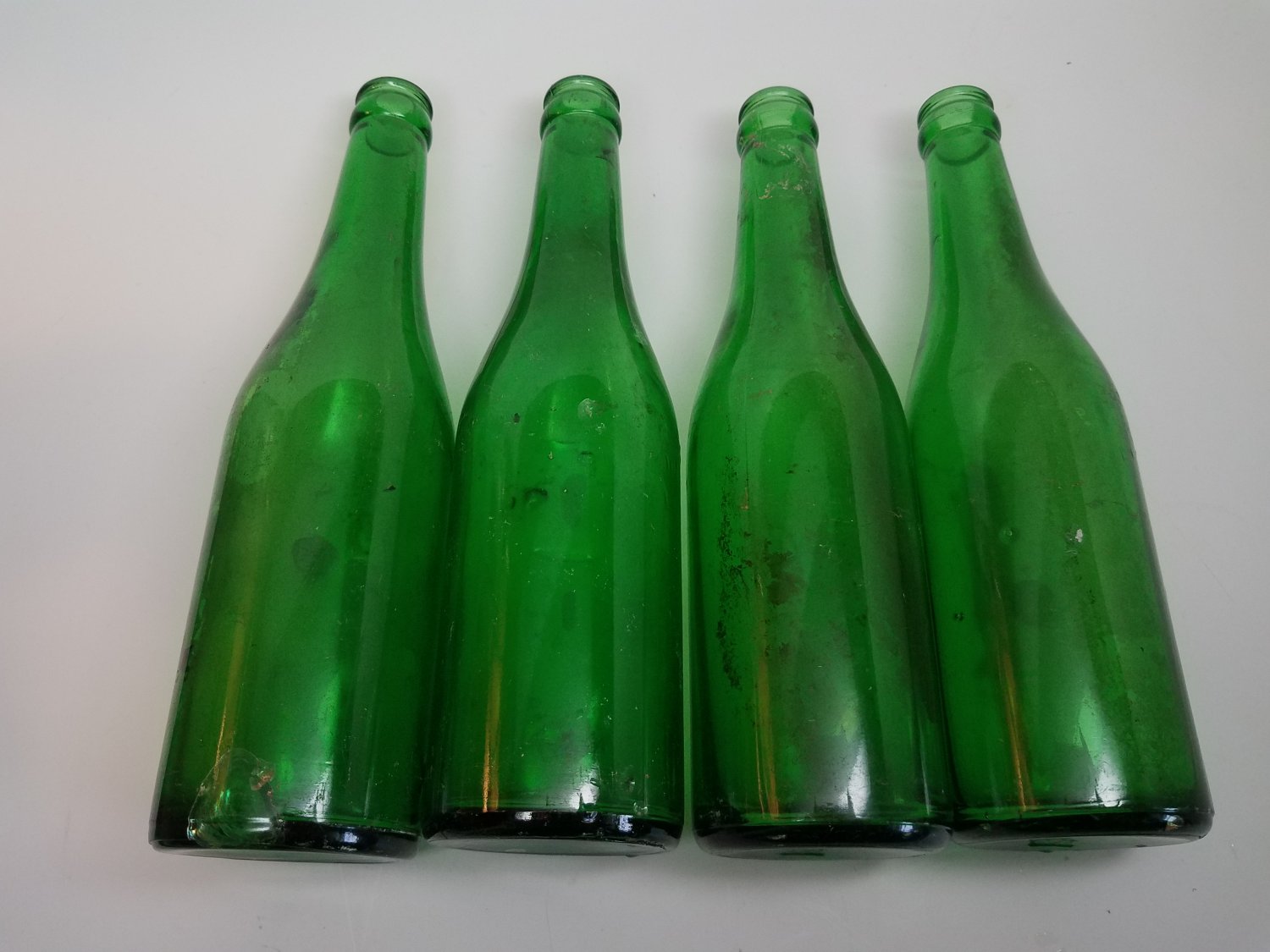 4 VINTAGE Green Soda Bottles