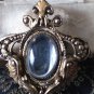 VINTAGE Nice 1980's Goldtone Ornate Framed Clear Faux Glass Cabochon BROOCH.