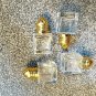 one set of 4 small clear glass/golden metal individual salt & pepper shakers