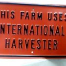 THIS FARM USES INTERNATIONAL HARVESTOR SIGN METAL ADV F