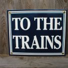 TO THE TRAINS PORCELAIN-COATED RAILROAD SIGN M