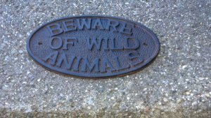 BEWARE OF WILD ANIMALS OVAL SIGN CAST IRON