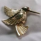 Gold tone Hummingbird pin with red crystal eye