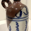 Bill Brigham Cowtown USA Glazed Brown, white, and Blue Ceramic Jug
