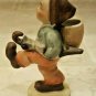 Hummel-Like Boy Figurine Depicting Boy Coming from Market with Umbrella & Basket