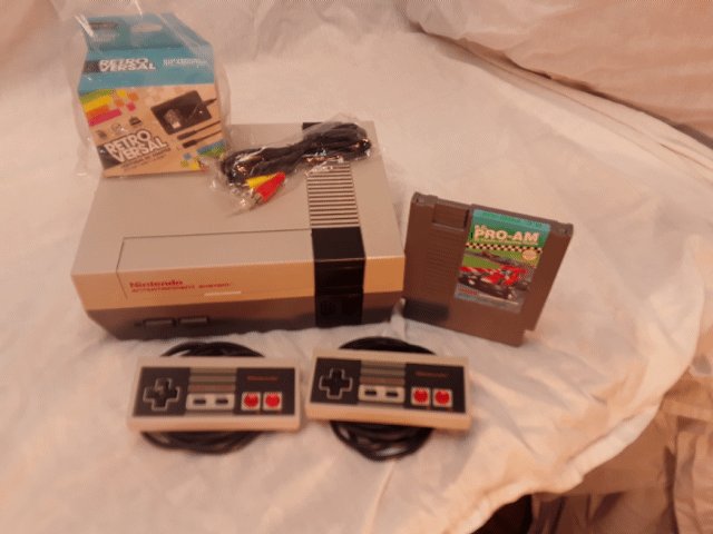 Nintendo nes console with two controllers