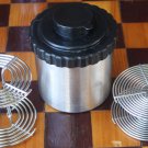 FILM DEVELOPING CANISTER WITH REELS