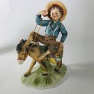 Vintage ceramic boy on donkey figure  8” x 6”