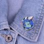 A Dragon with succulent plants designed by Meredith Dillman enamel pin art accessories