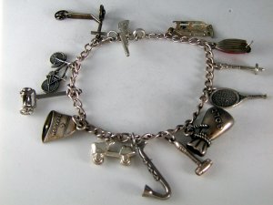 VINTAGE STERLING SILVER CHARM BRACELET AND CHARMS