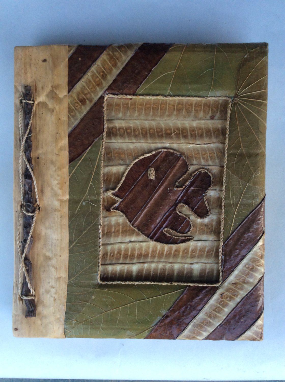 Photo album made from natural products holds 80 photos