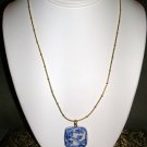Necklace with blue and white pendant