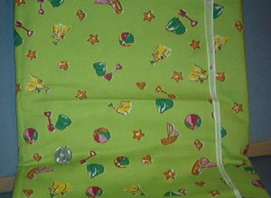 Sewing Fabric Cotton No 305 Sand toys on green