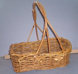 Basket - Rough weave, w/handle, 11X7X4" with 13" hi handle.  Darker than appears in picture