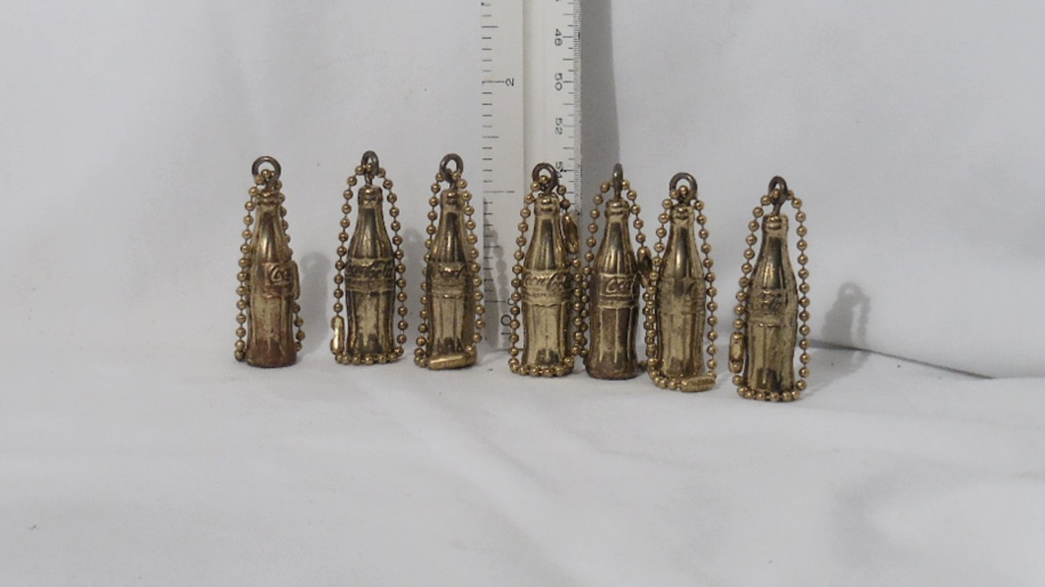 LOT OF 7 COCA COLA COKE BOTTLE KEYCHAINS GOLD TONE KEY RING VINTAGE