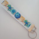 Blue and beige seashell key fob wristlet Blue and beige seashell key fob wristlet