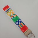 Blue green yellow and red pattern key fob wristlet Blue green yellow and red pattern key fob wristlet