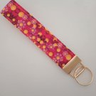 Bright pink and yellow flower key fob wristlet