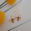 Gold yellow and black bee charm earrings