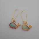 Gold green and white whale charm earrings