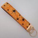 Orange and black spider web key fob wristlet Orange and black spider web key fob wristlet