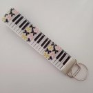 Piano / music and bow print key fob wristlet