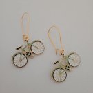 Gold bicycle charm earrings
