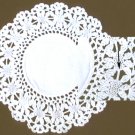 Doily hand crocheted with manufactured lace insert around linen center