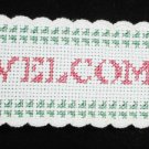 Completed cross stitch finger towel border strip Welcome with hearts