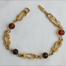 Avon tooled gold tone amber plastic bead bracelet