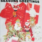 Plastic Canvas Seasons Greetings oranments and package designs