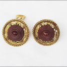 Bakelite earrings round open work with button center clips unmarked Bakelite earrings round open work with button center clips unmarked