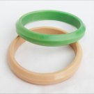 Two hard plastic bracelets pink green pastels beveled edges Two hard plastic bracelets pink green pastels beveled edges