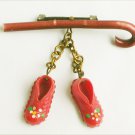 Vintage pin cane with plastic red shoes maybe dancing award