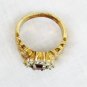Ring red pronged stone wih rhinestones large size 9 1/2 wide gold tone band