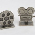 Sceneit 2002 movie replacement tokens camera & film reel probably pewter Sceneit 2002 movie replacement tokens camera & film reel probably pewter