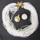 Multi strand white small beaded necklace flower clasp & clip earrings demi parure set
