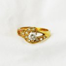 Large clear stone ring gold tone surrounded by rhinestones size 8 Large clear stone ring gold tone surrounded by rhinestones size 8