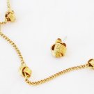 Avon gold tone knot necklace and stud earring set Avon gold tone knot necklace and stud earring set