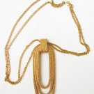 Monet gold tone double chain necklace with oval loop pendant tooled surface