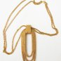Monet gold tone double chain necklace with oval loop pendant tooled surface