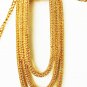 Monet gold tone double chain necklace with oval loop pendant tooled surface