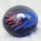 Dynasty Heirloom paperweight large round blue cobalt bottom red swirls inside