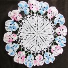 Doily hand crocheted white with pink & blue border 9" diameter