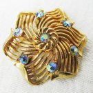 Lisner gold tone pin blue aurora iridescent rhinestones 1 1/2" Lisner gold tone pin blue aurora iridescent rhinestones 1 1/2"