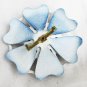 Enamel flower pin navy background white lattice petals red center jewelry