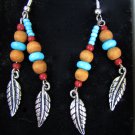 Avon Turquoise color beaded drop earrings with feathers new in box