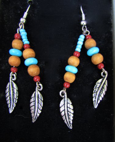 Avon Turquoise color beaded drop earrings with feathers new in box